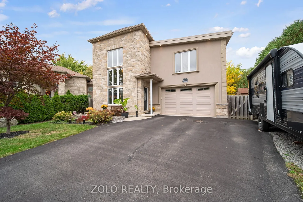 6911B Hickling Crescent — photo 2